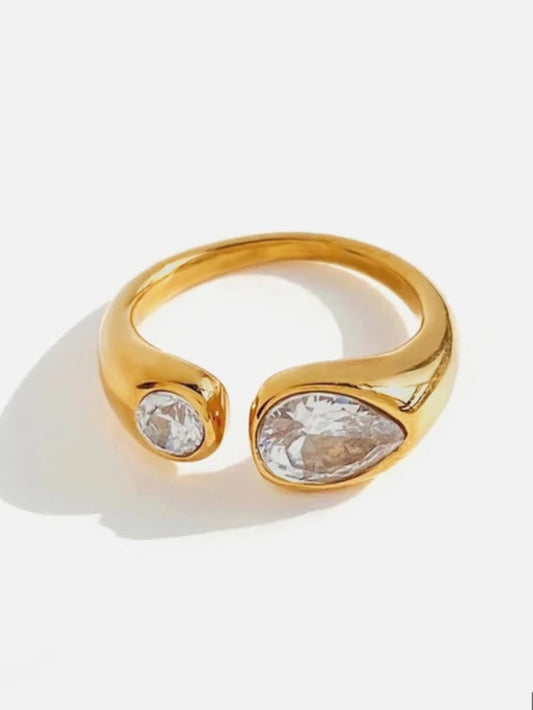Gold ring with two clear gemstones