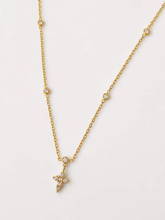 Gold necklace with a cross-shaped pendant