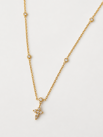 Gold necklace with a cross-shaped pendant