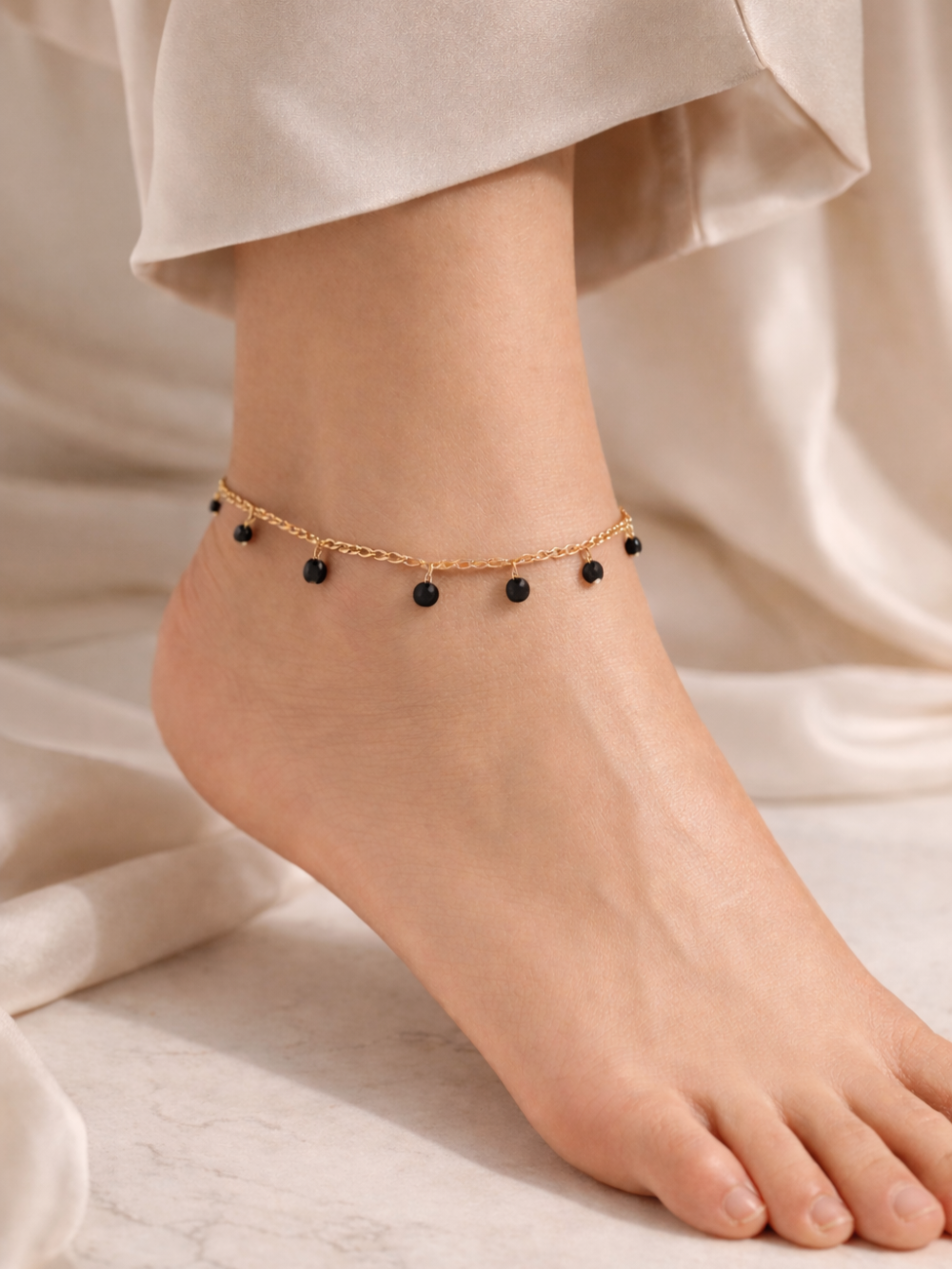 Anchored anklet with black beads