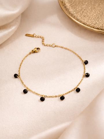 Gold bracelet with black beads