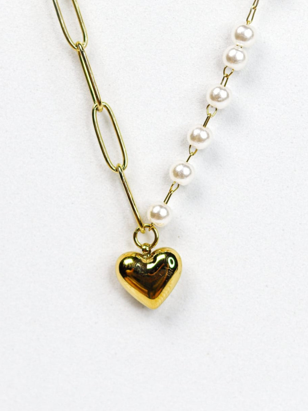 Necklace with gold heart pendant and pearl chain 