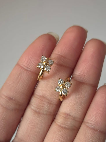 Gold earrings with diamond-like stones 