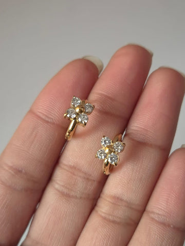Gold earrings with diamond-like stones 