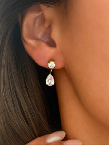 gold and clear teardrop earring.