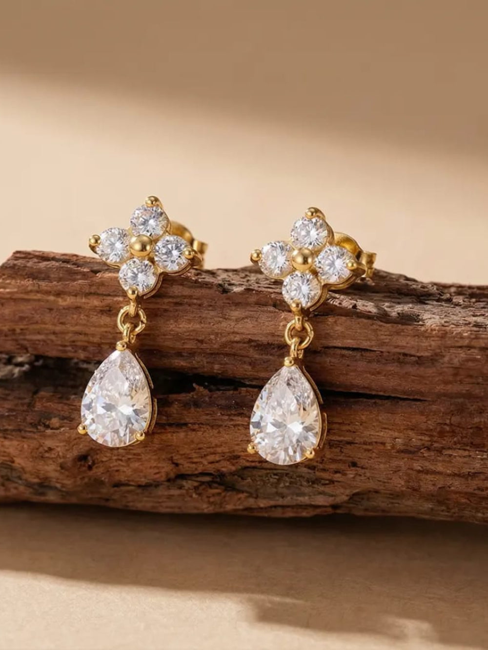 Gold earrings with clear gemstones