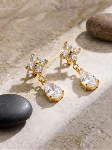 Gold earrings with clear teardrop-shaped gemstones