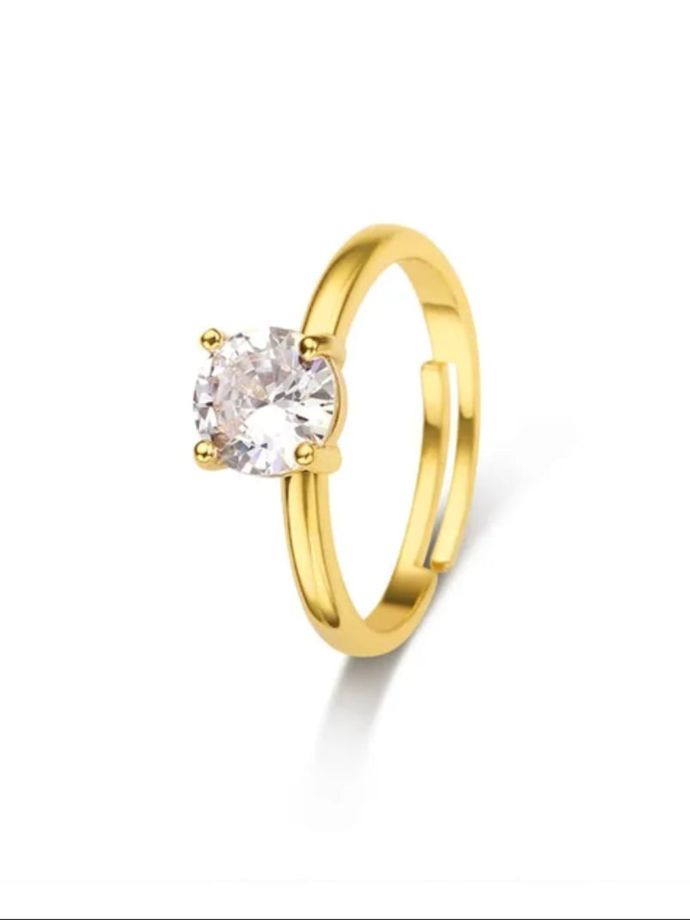Gold ring with a clear gemstone