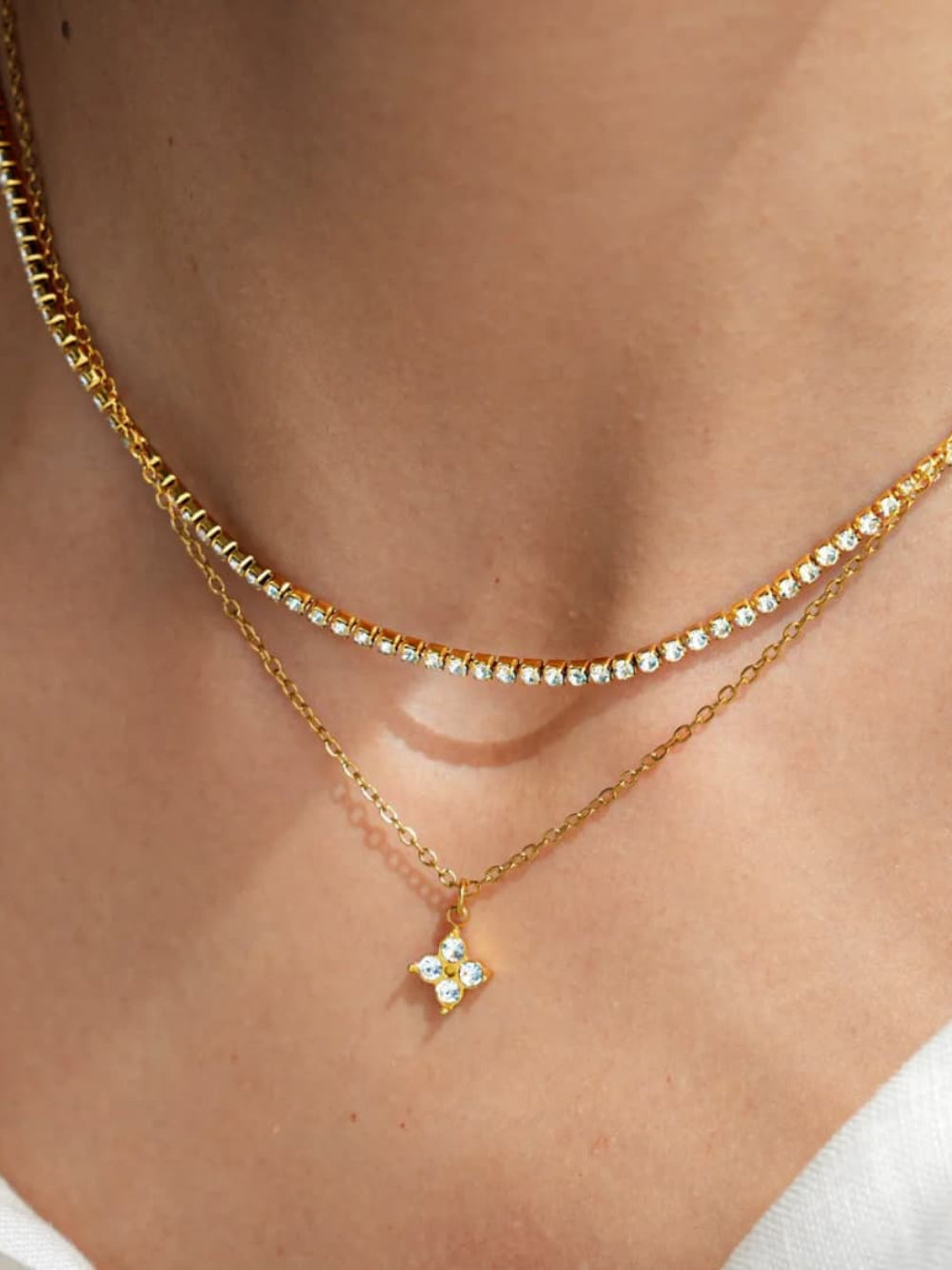 gold necklace with a star-shaped pendant.