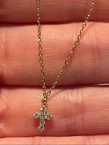 Gold necklace with a cross pendant