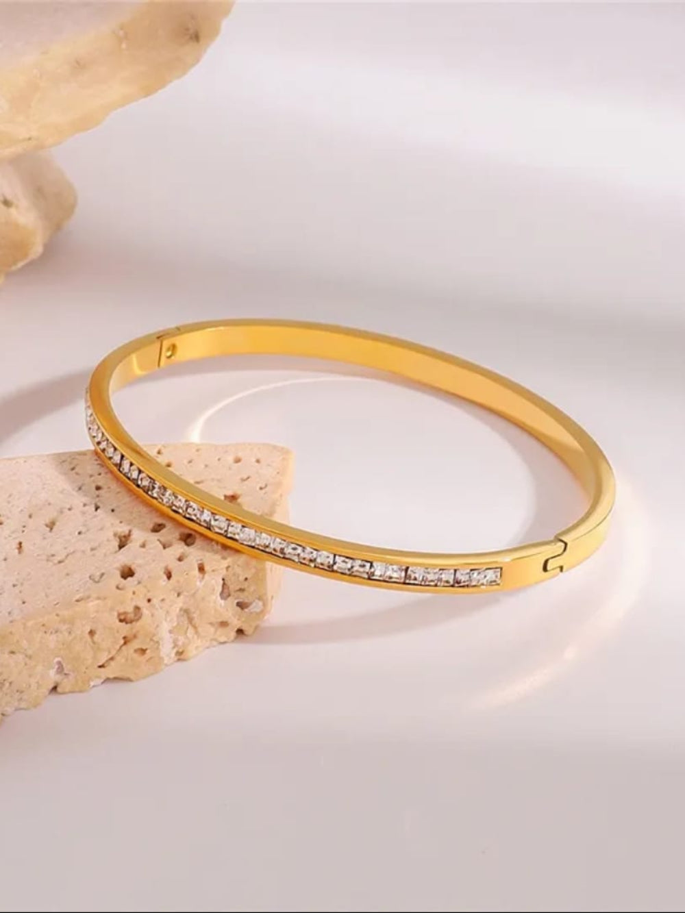 Gold bracelet with small stones