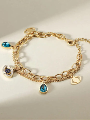 Gold bracelet with evil eye-shaped charms