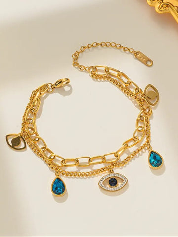 Gold bracelet with blue gemstone charms
