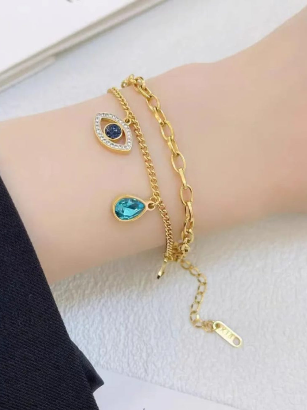 Gold bracelet with blue gemstone
