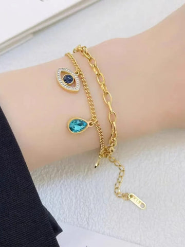Gold bracelet with blue gemstone