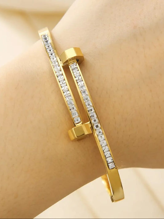 Gold bracelet with clear stones