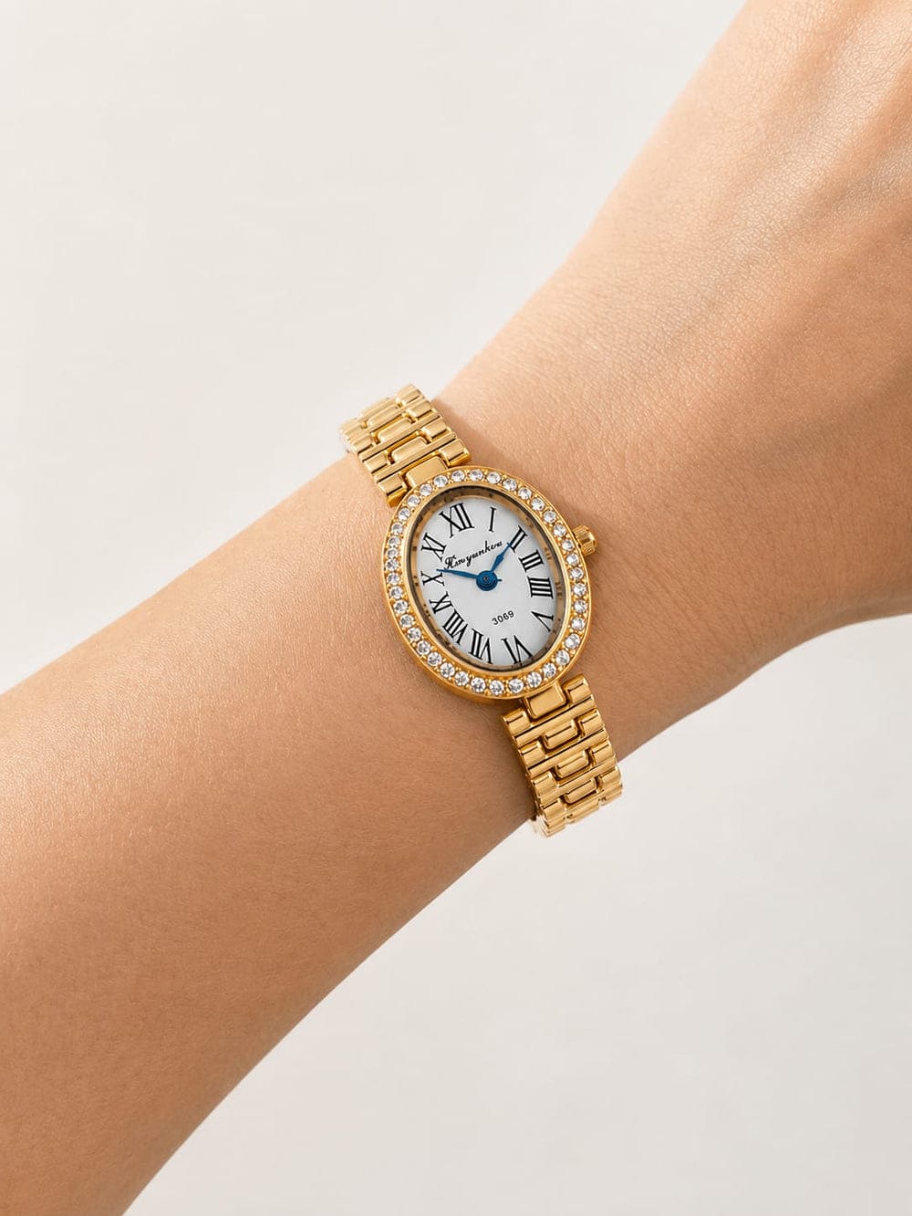 Crystal Bezel Oval Gold Watch QROSH
