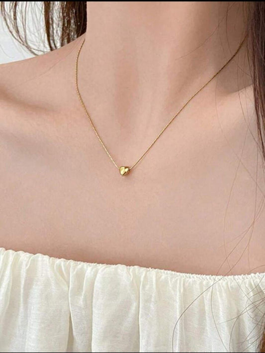 Gold necklace with a heart pendant